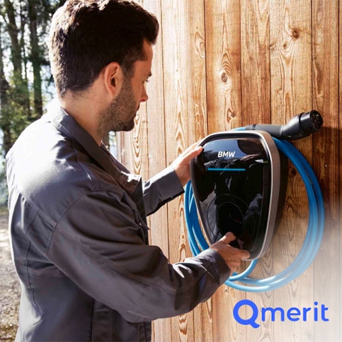 Image of a technician installing the BMW Wallbox Charger at someone's home