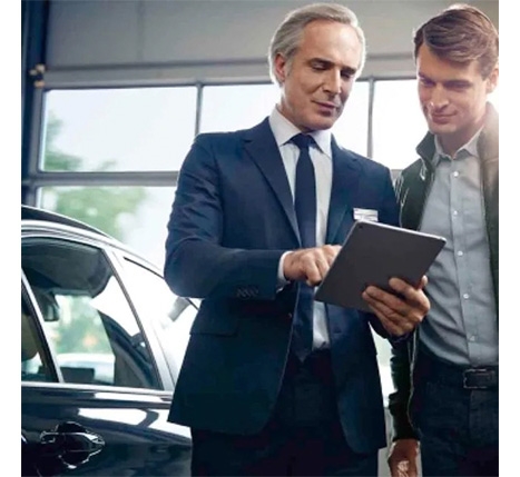 Image of BMW representative speaking with a customer