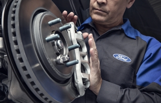 Ford technician working on brake repair