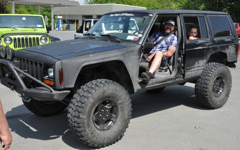 A black Jeep Cherokee from the side.