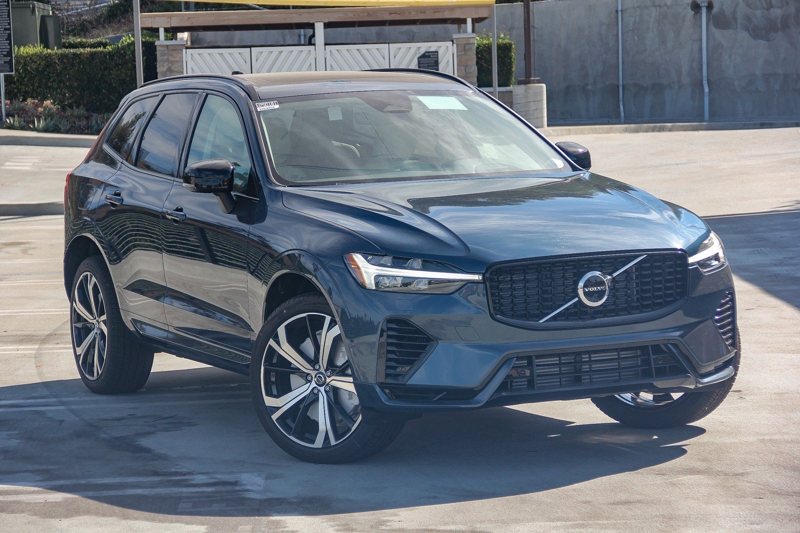 blue 2025 Volvo XC60 SUV parked at the Volvo Cars Mission Viejo dealership in Mission Viejo, CA