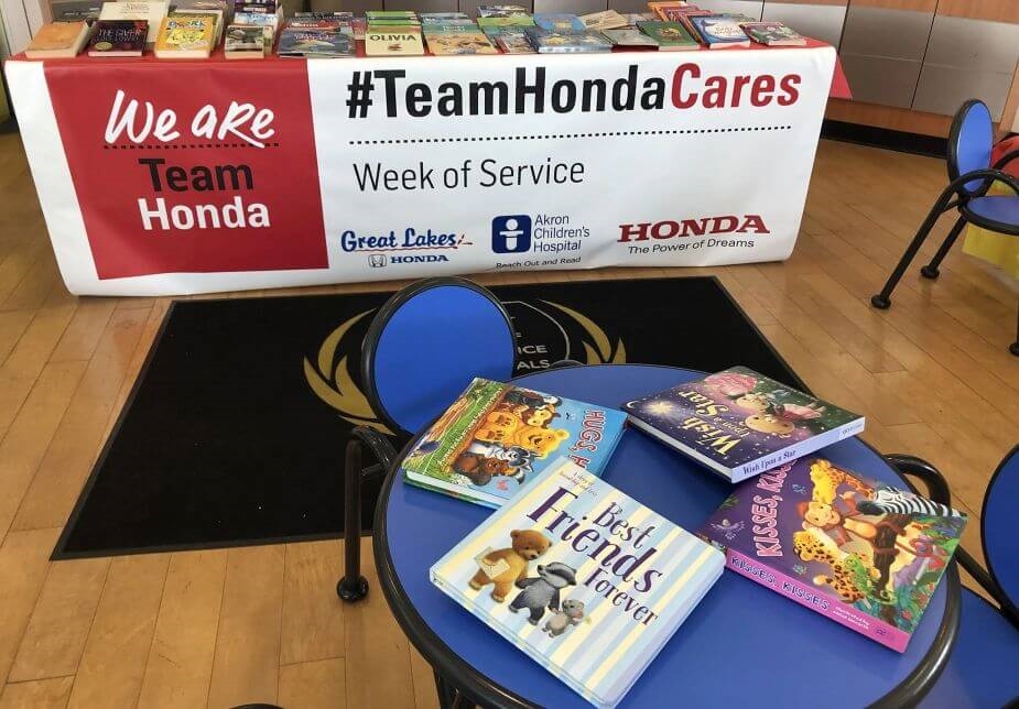 Vinyl banner display at Reach Out and Read community event, sponsored by Great Lakes Honda