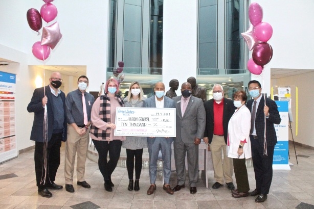 Great Lakes Honda and Akron General staff holding check to support breast cancer awareness campaign