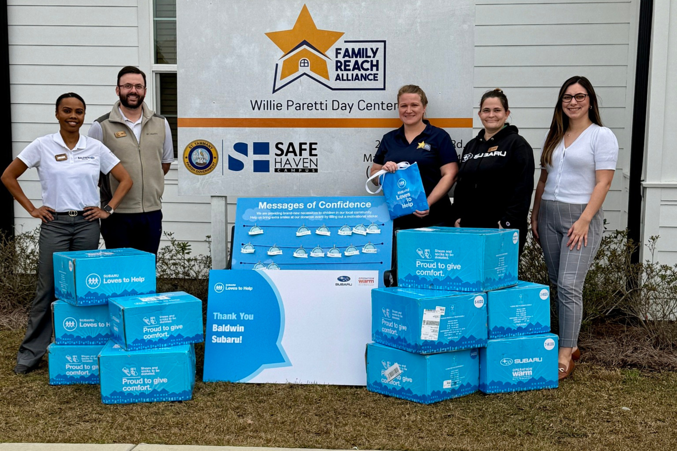 Volunteers providing socks and shoes to local kids