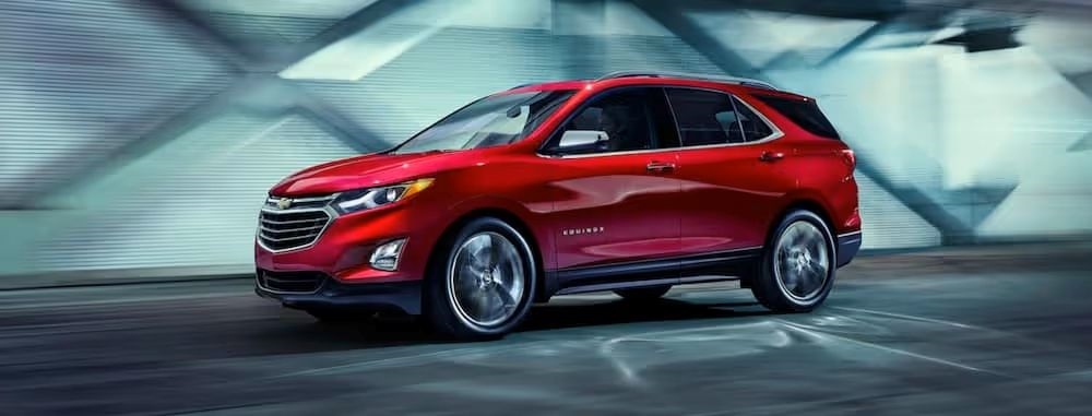 Red Chevy Equinox driving in a tunnel