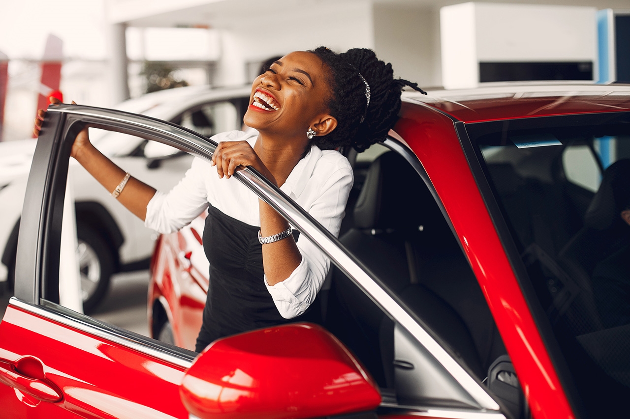 Woman happy getting out of car