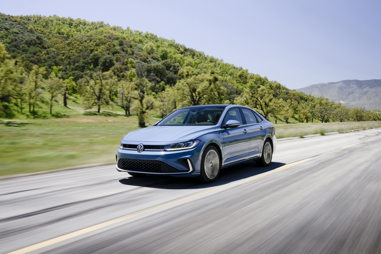 Blue 2026 Volkswagen Jetta cruising