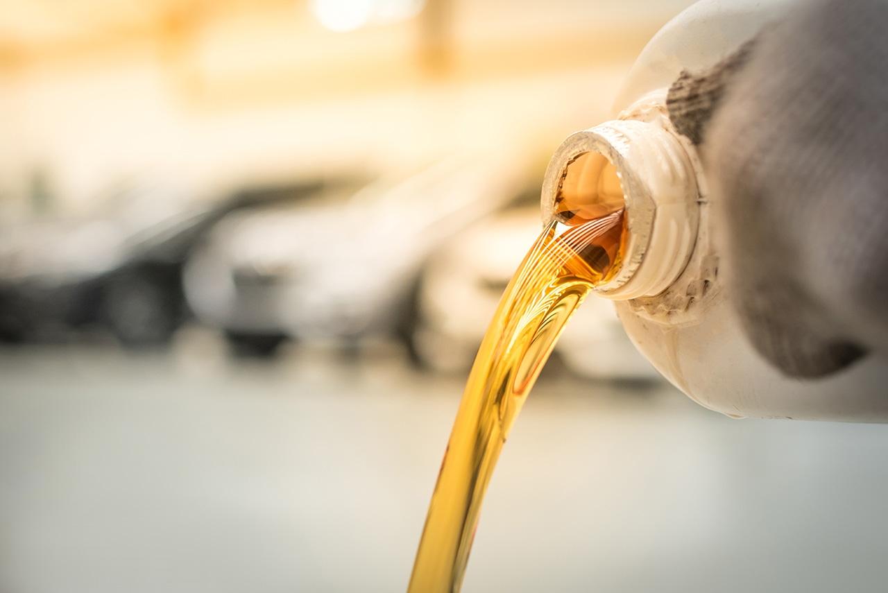 close up of pouring motor oil