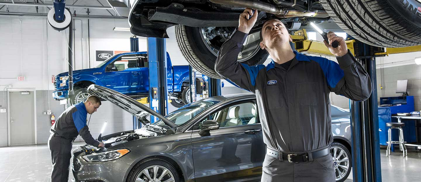 Ford service technicians servicing Ford vehicles at service center