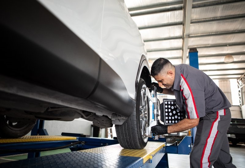 Tire balancing service in progress using balancing equipment on the vehicle wheel in Akron, OH