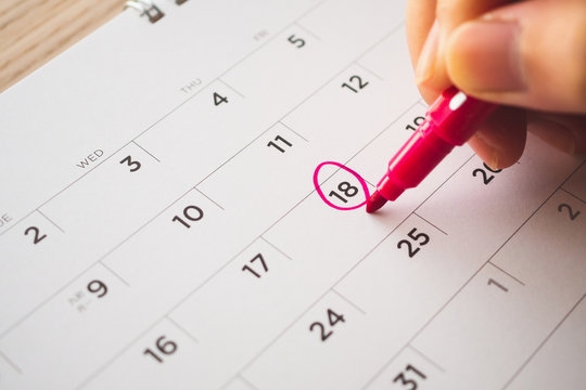 circling date on calendar stock image