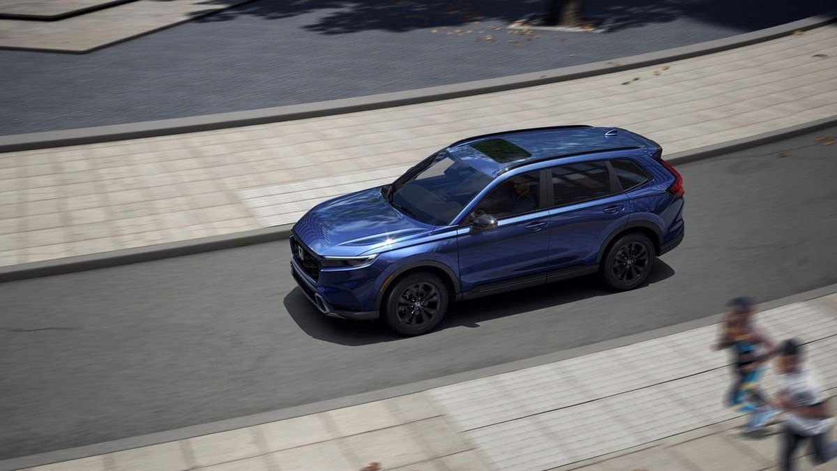 2026 Honda CR-V driving through a residential Elyria-area street