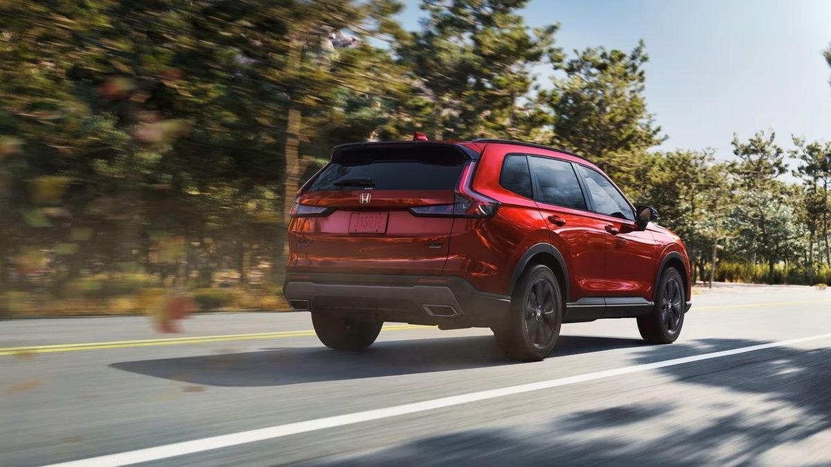 2026 Honda CR-V Sport Touring Hybrid rear three-quarter view on a highway