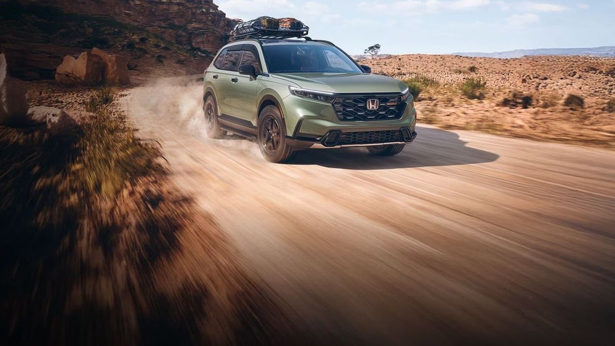 2026 Honda CR-V TrailSport Hybrid in Ash Green Metallic on a dirt trail