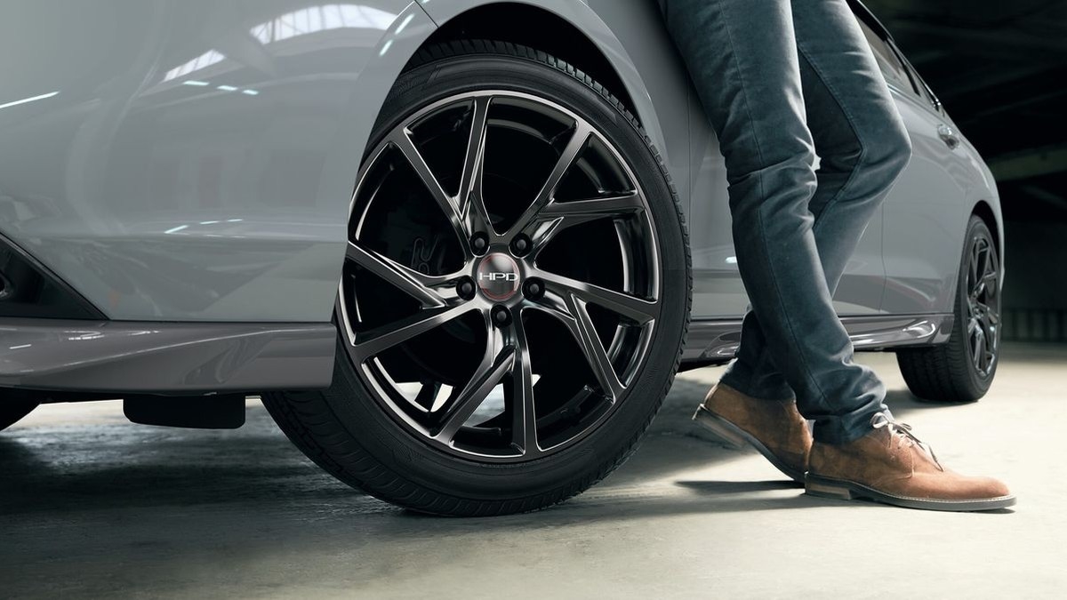 Close-up of a 2026 Honda Accord's 19-inch black alloy wheel and tire