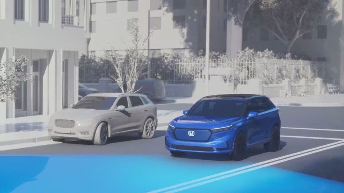 Honda Sensing driver-assist illustration showing a vehicle detecting nearby traffic