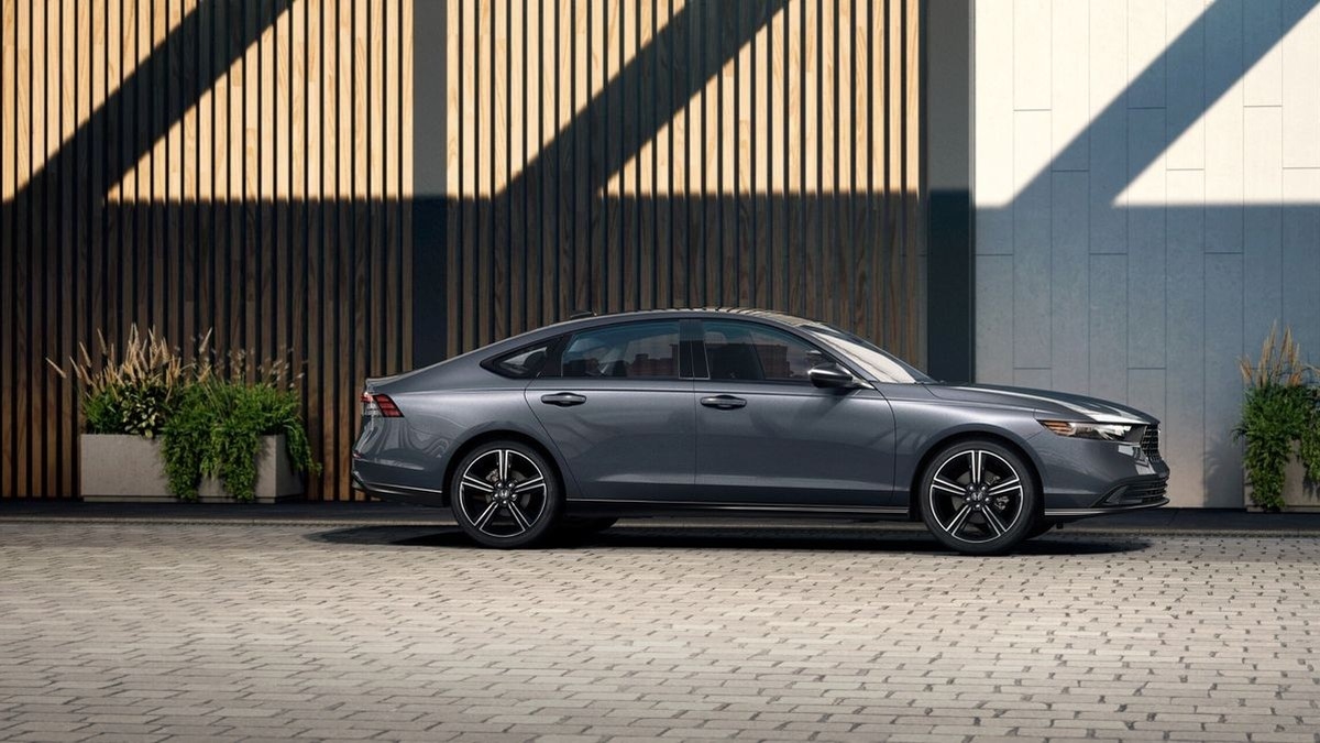 2026 Honda Accord sedan in gray parked beside a wood-slat wall