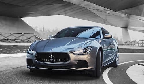 Silver Maserati driving on road Maserati Jacksonville Jacksonville FL