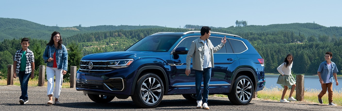 2023 VW Atlas parked surrounded by people