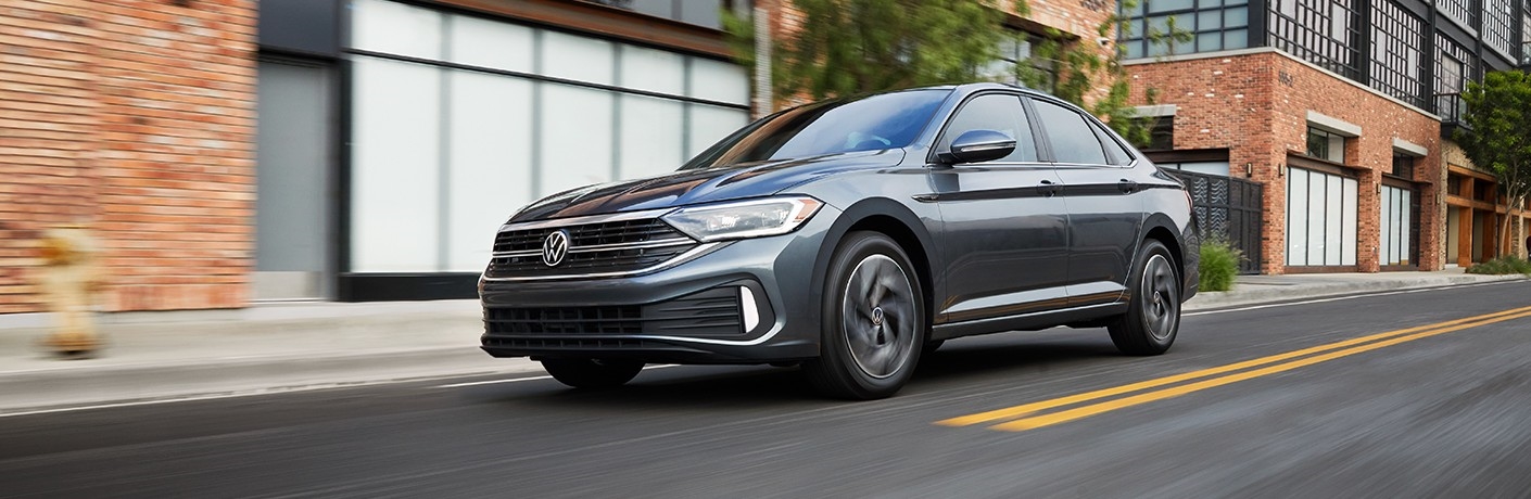 2023 VW Jetta driving down city street