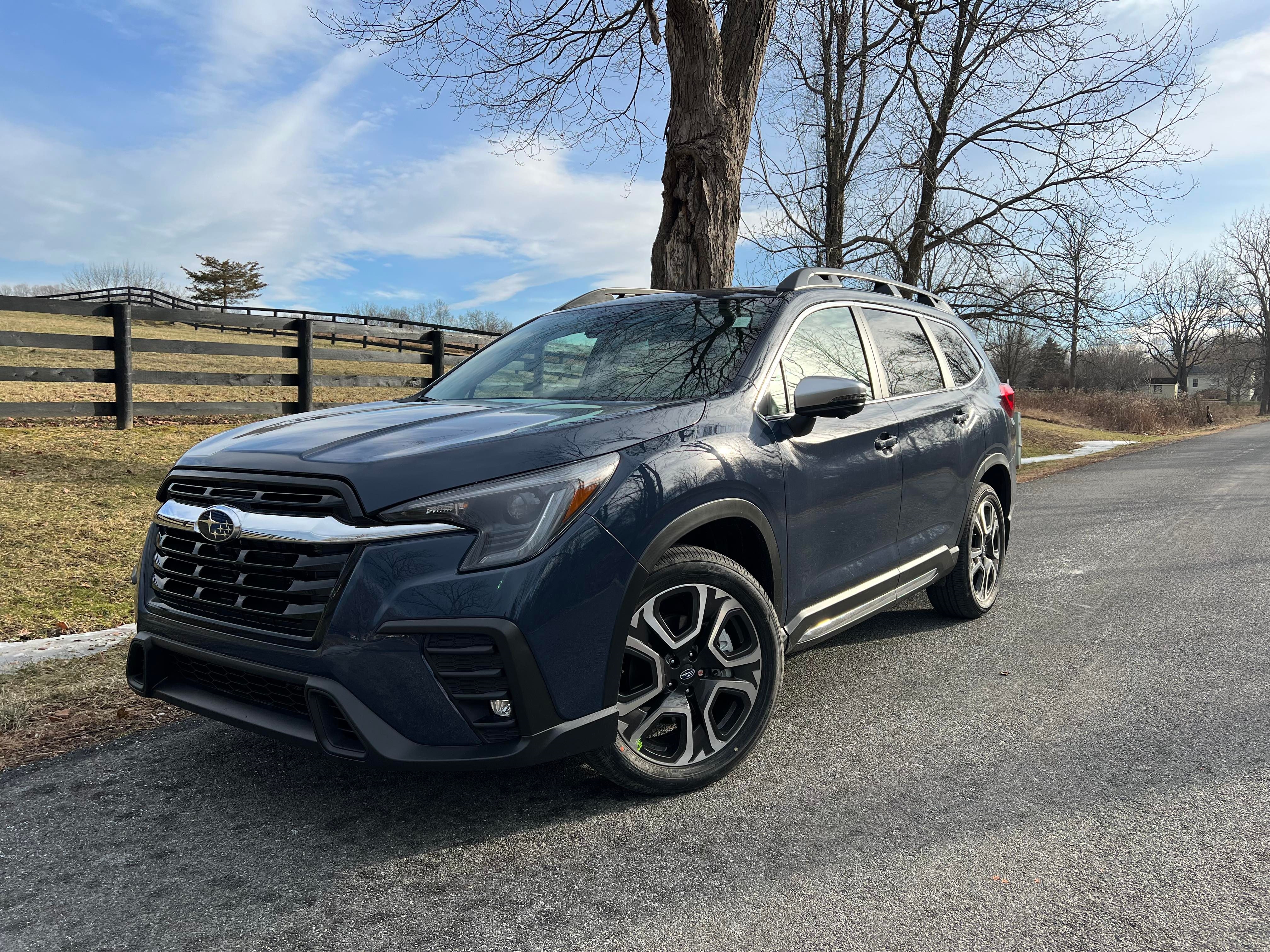 A blue 2024 Subaru Ascent parked on a road in Rhinebeck, NY.