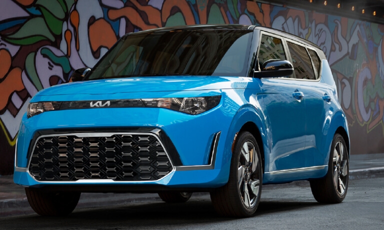2023 Kia Soul parked in front of a graffiti wall