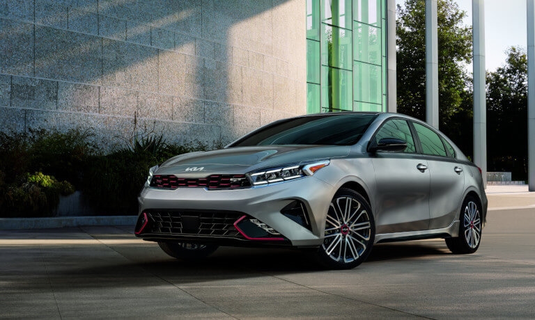 2023 Kia Forte parked by a commercial building