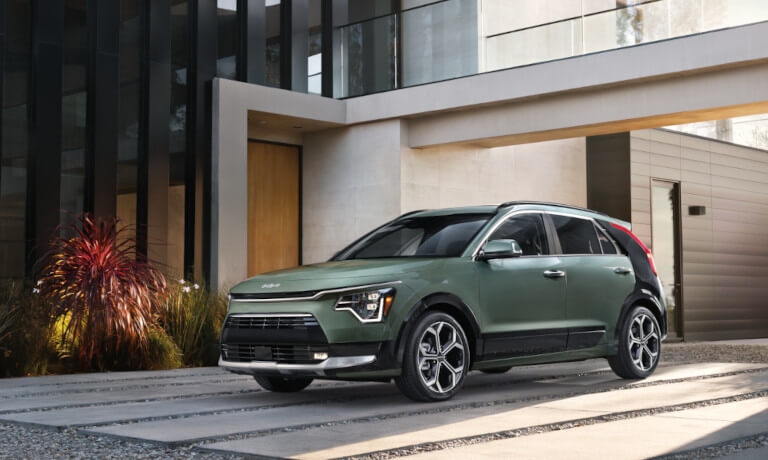 2023 Kia Niro parked by modern building