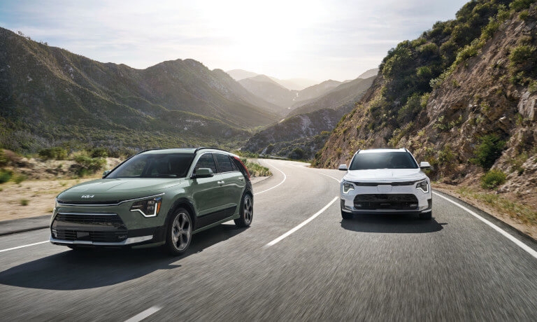 2023 Kia Niro driving on a curved mountain road