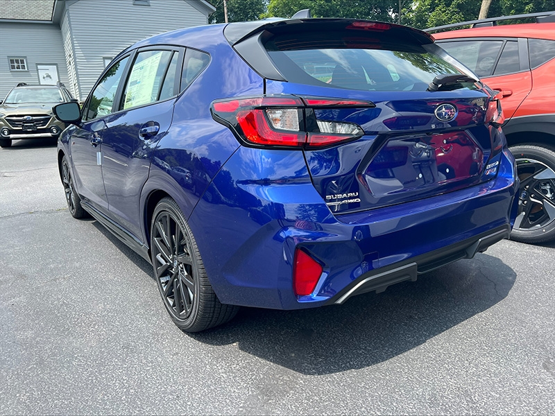 Rear view of a blue 2025 Subaru Impreza RS.