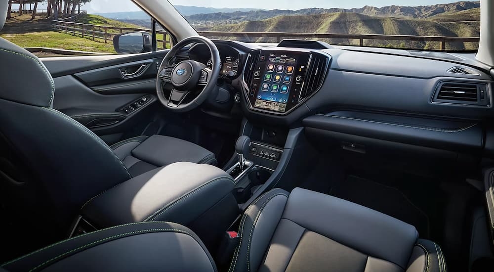 A view of the dashboard of a 2023 Subaru Ascent for sale shows the infotainment screen and steering wheel.