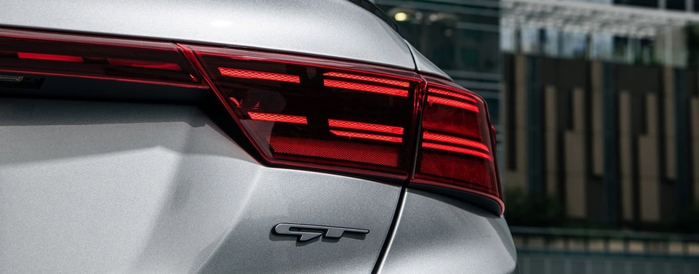 The passanger side taillight is shown on a silver 2022 Kia Forte GT.