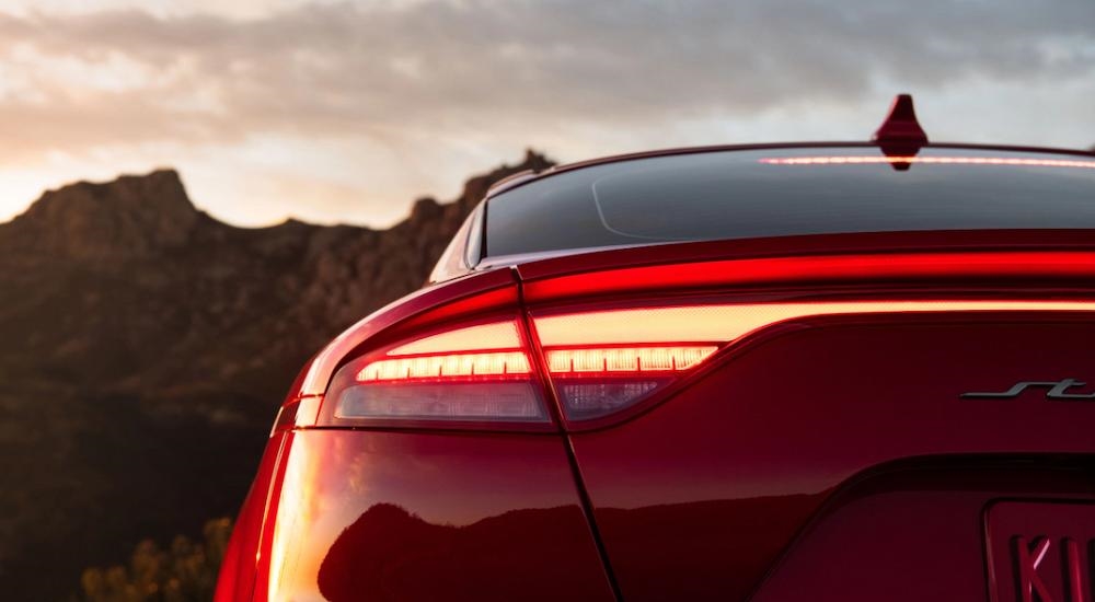 A close up of the brake light on a red 2023 Kia Stinger.