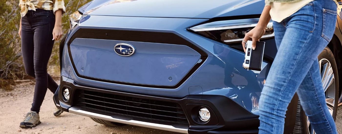 A close up shwos the grille on a blue 2023 Subaru Solterra for sale.