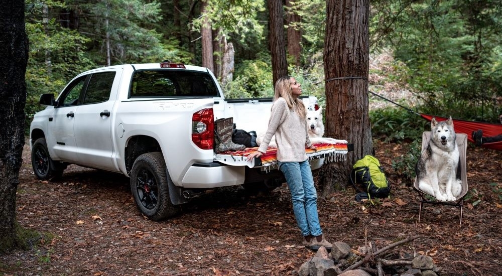 A white 2021 Toyota Tundra TRD Pro is shown at a campsite.