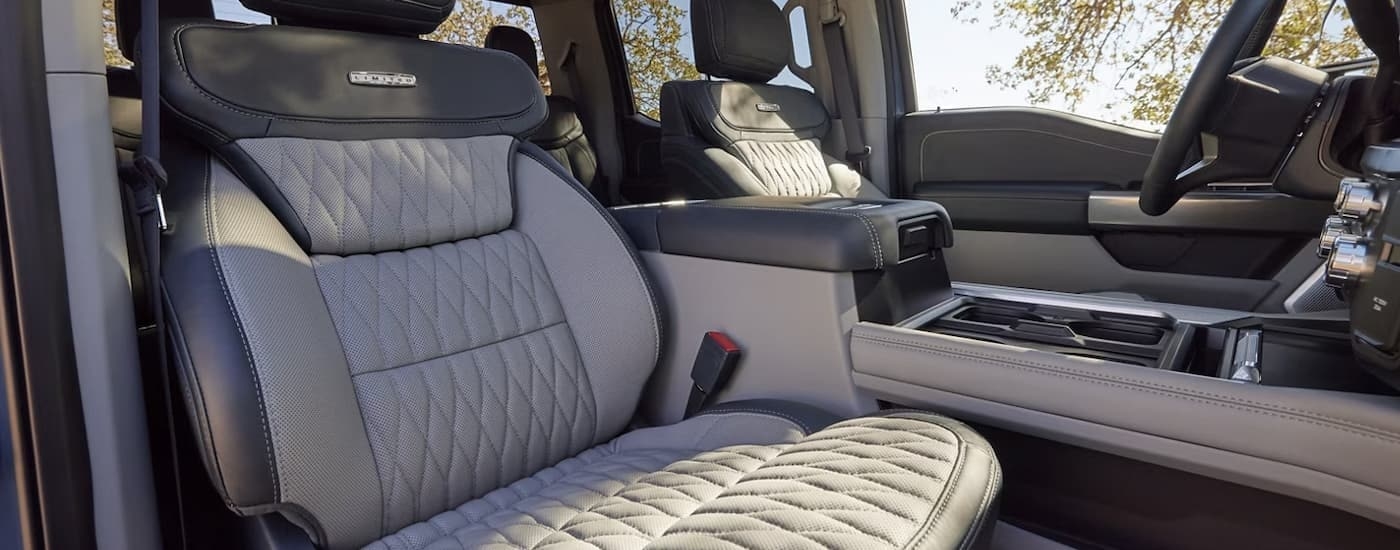 The black and grey front seats in a 2024 Ford F-350 Limited are shown.