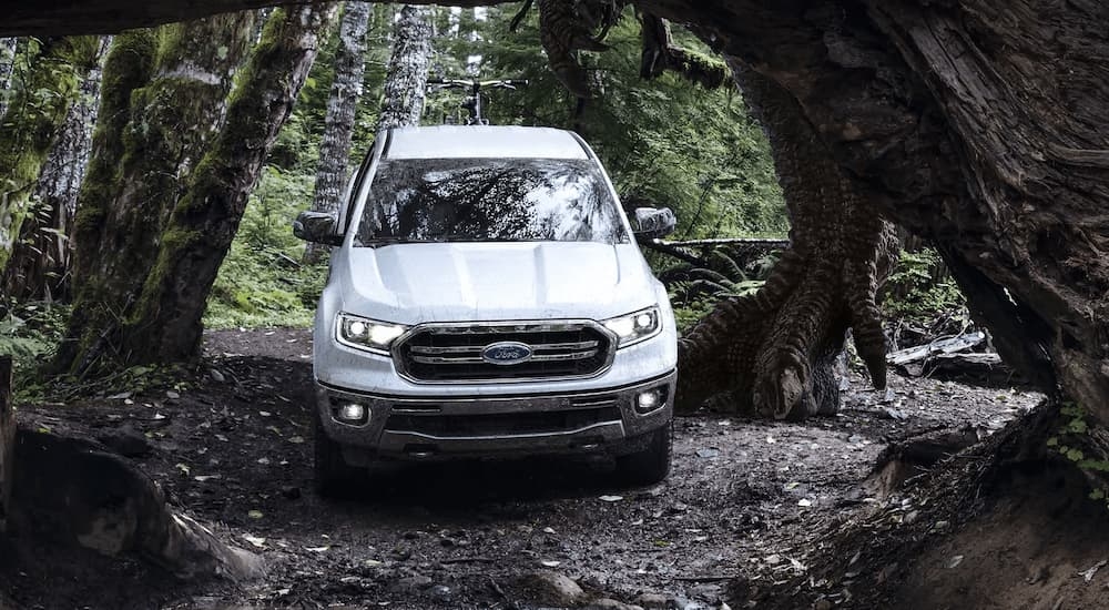 A white 2019 Ford Ranger Lariat is shown from the front after leaving a used Ford dealership.