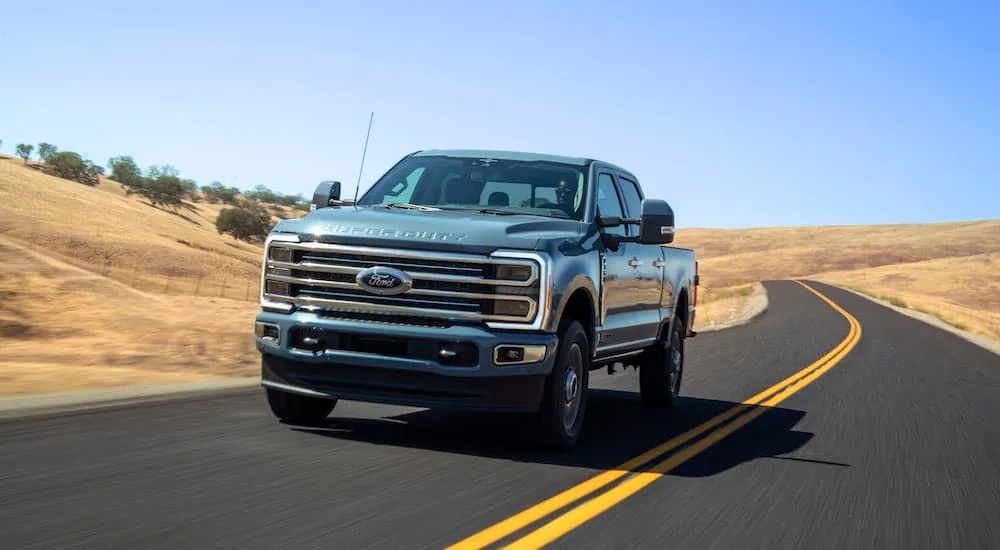 A light blue 2023 Ford F-350 is shown front after leaving a dealer that has a Ford F-350 for sale.