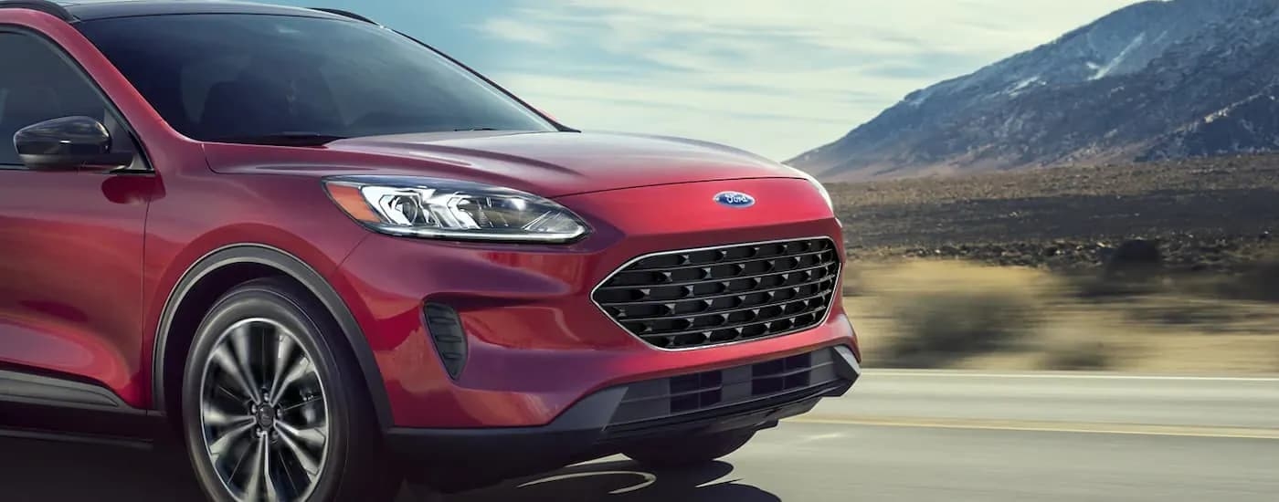 A red 2022 Ford Escape is shown after leaving a Red Hook Ford dealership.