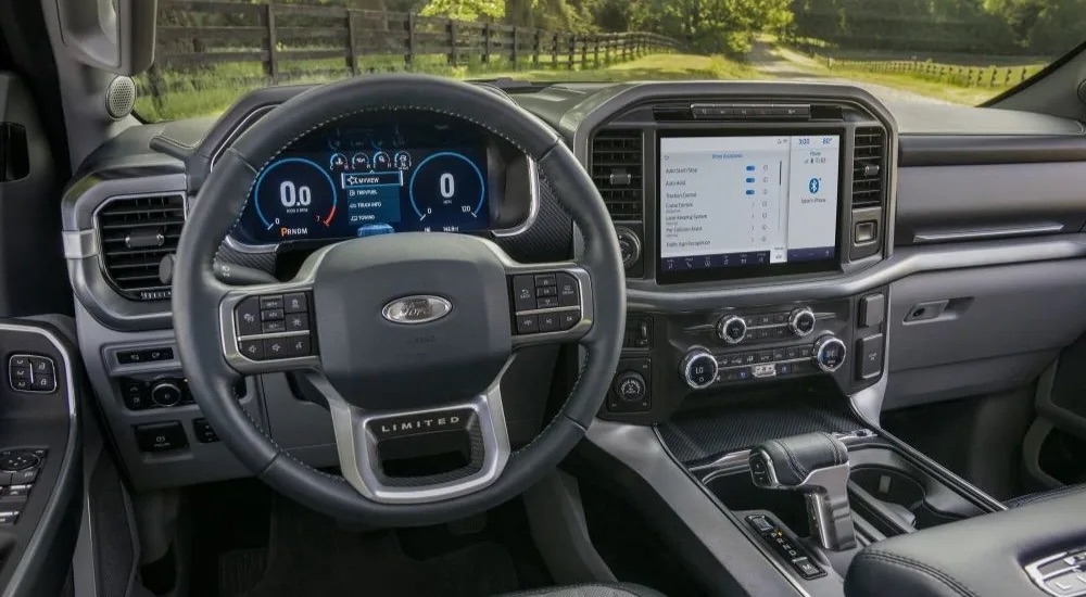 The grey dash and interior is shown in a 2022 Ford F-150 Limited.