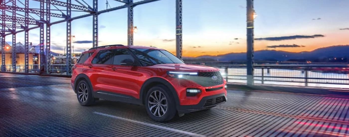 A red 2021 Ford Explorer ST is shown from the front at an angle after receiving a car trade-in value.