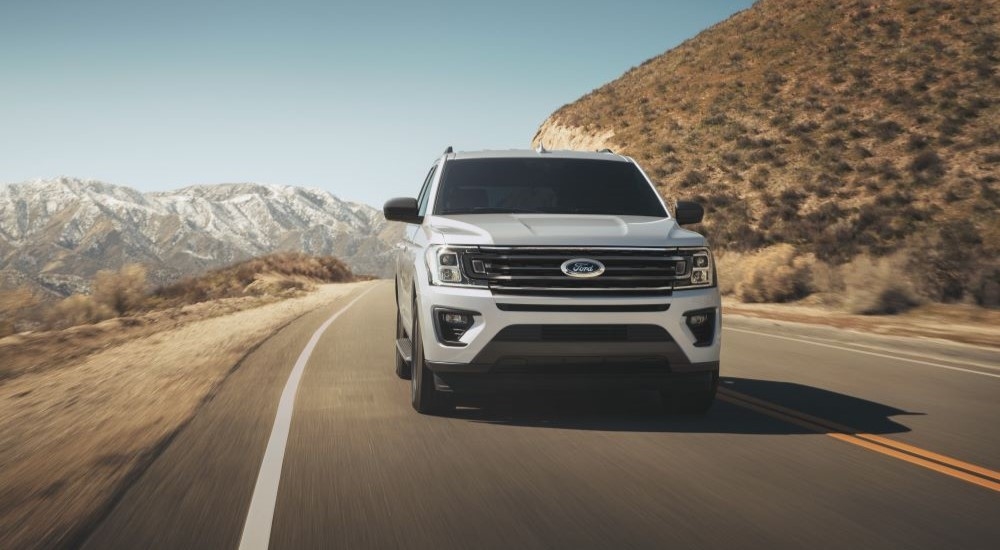 A white 2022 Ford Expedition XL STX is shown from the front after leaving a Red Hood Ford dealer.