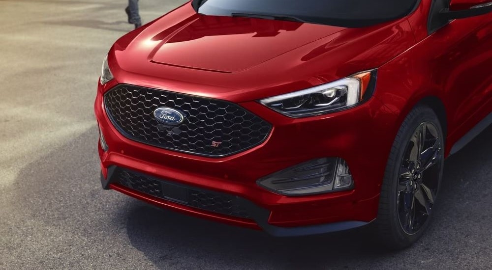 A close up shows the grille on a red 2022 Ford Edge ST.