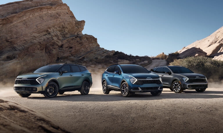 Three 2024 Kia Sportages in the desert