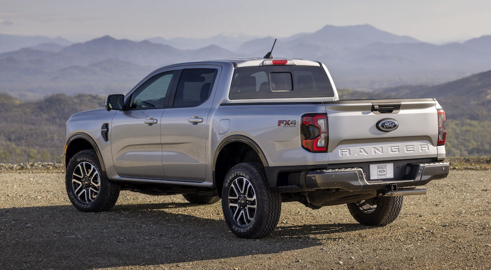 A silver 2024 Ford Ranger Lariat is shown from the rear at an angle after leaving a dealer that has a Ford Ranger for sale.