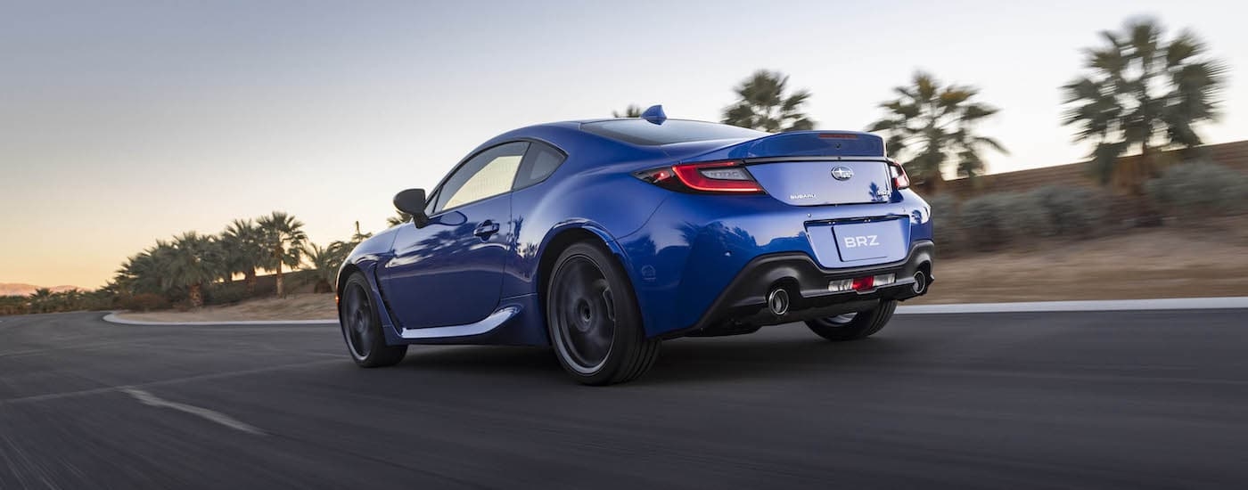 A blue 2023 Subaru BRZ is shown from the rear at an angle afer leaving a car dealership in Rhinebeck.