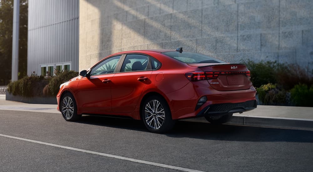 A red 2024 Kia Forte parked at a San Antonio Kia dealer.