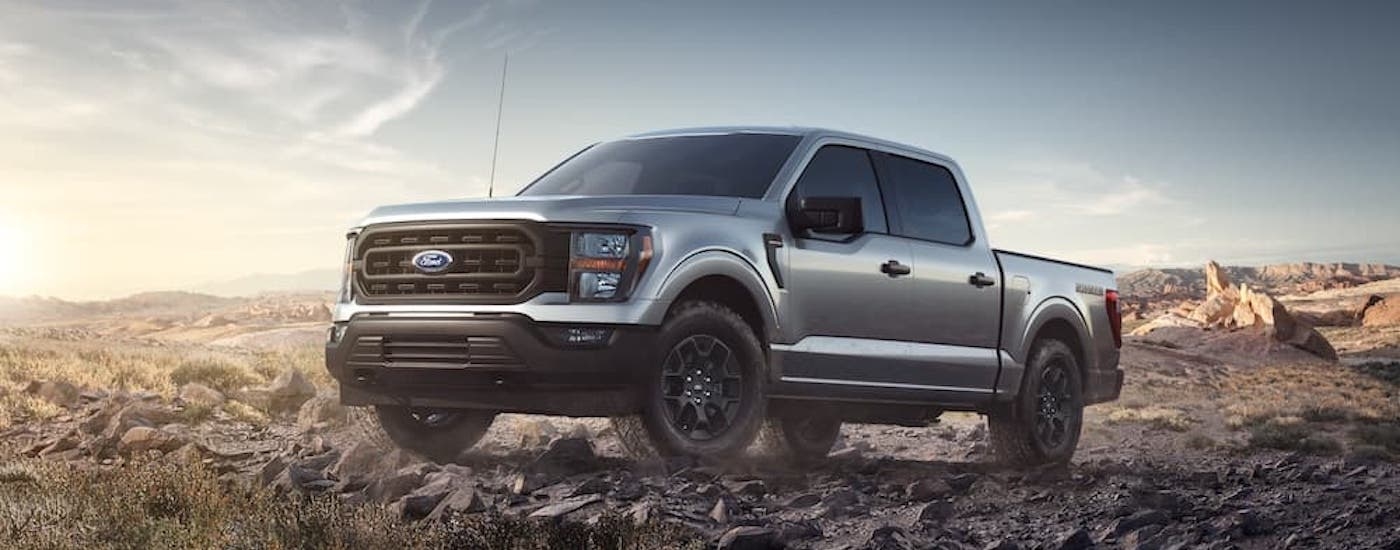 A silver 2023 Ford F-150 Rattler is shown from the front at an angle after leaving a dealer that has Ford trucks for sale near Red Hook.