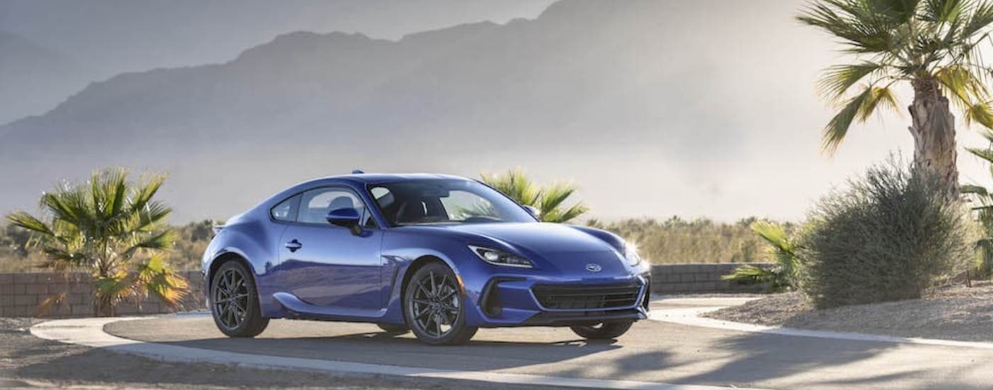 A blue 2023 Subaru BRZ is shown from the front at an angle after leaving a car dealership near Red Hook.