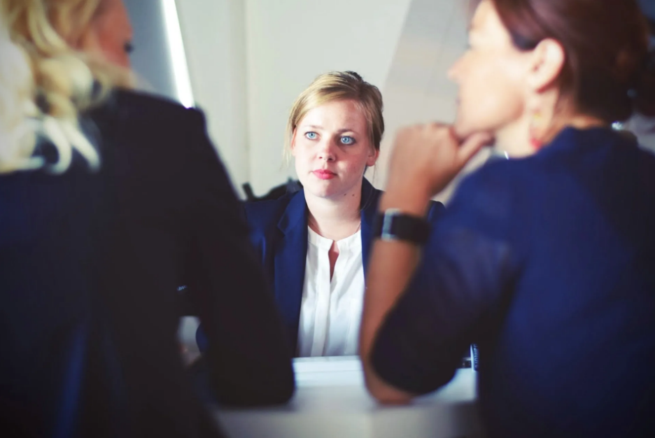 Woman discussing with two other people (New Volvo Vehicles Near Los Angeles)